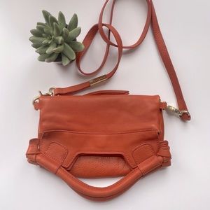 Foley & Corinna Leather disco city handbag In orange